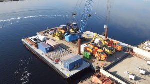 Crane and barge getting ready to salvage debris