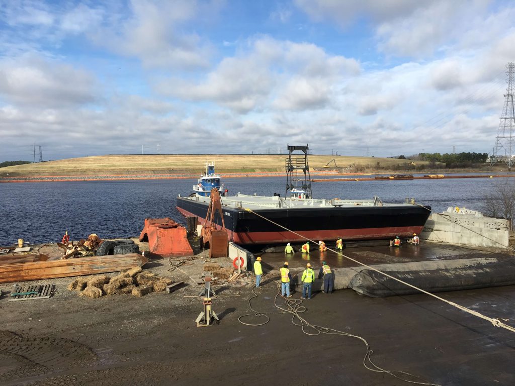barge setting off to sea with repairs and maintenance