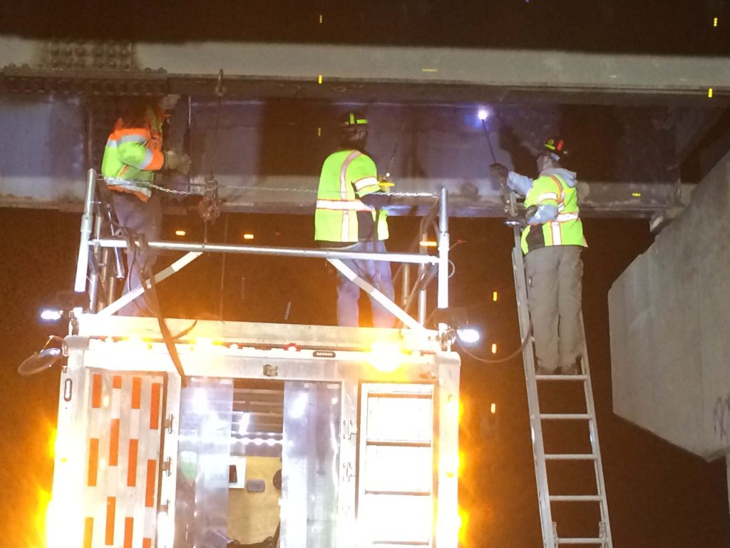 IMG_0317 precon marine construction workers soldering new beam panels under a bridge for emergency constructions