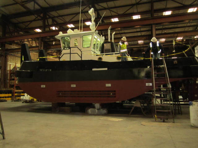 fabricated tugboat with new coat of marine paint.