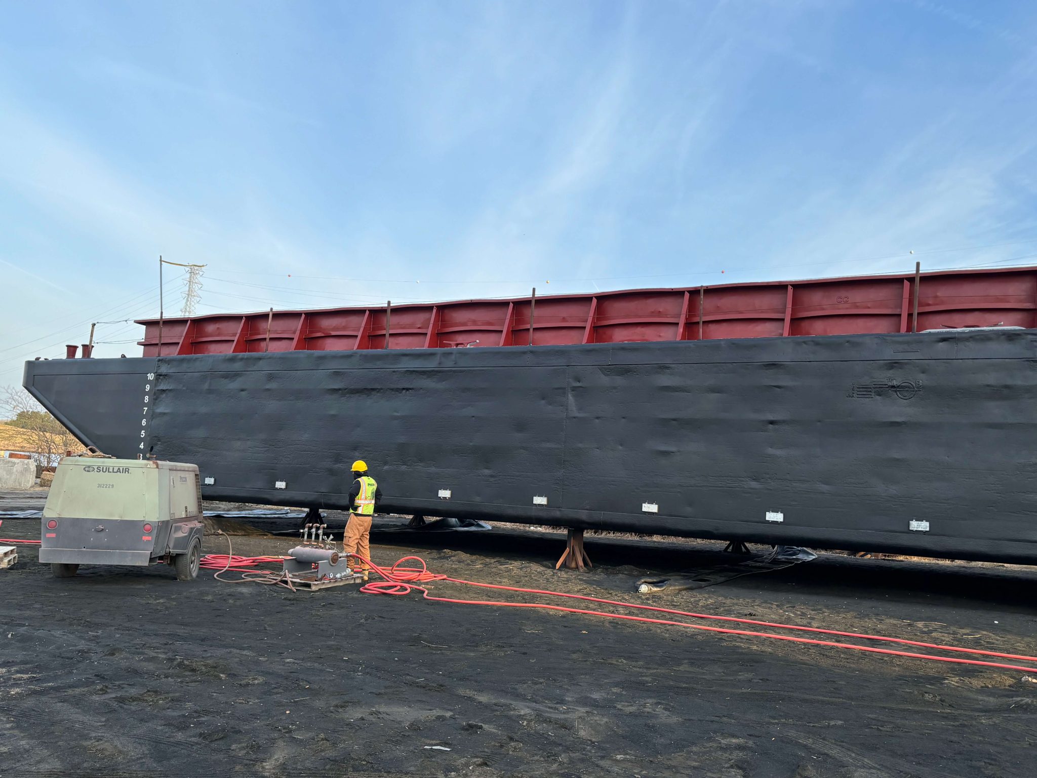 IMG_2372 out of water barge with new coat of marine protection paint