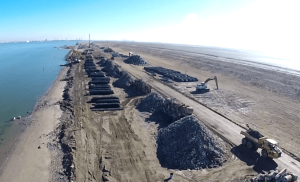 high angle view of stone piles waiting to be placed for riprap installation