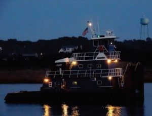 dotti-j (1) precon marine tugboat named Kristina Marie out on the docks at night with it's lights shining
